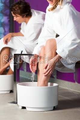 Couple having hydrotherapy water footbath