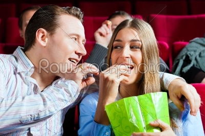 Couple in cinema with popcorn