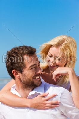Couple in love on summer beach 