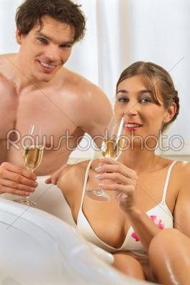 Couple is doing wellness with champagne 
