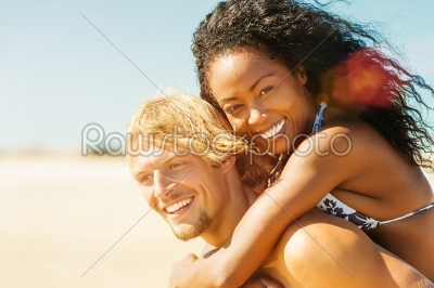 Couple on sunny beach in summer in vacation