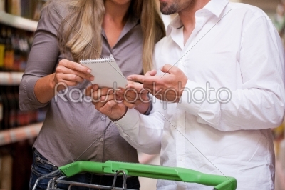 Couple Selecting Products at Supermarket