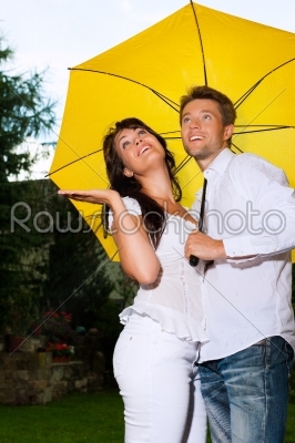 Couple with a yellow umbrella