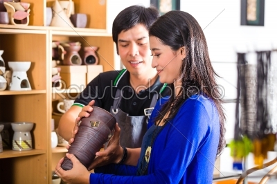 Customer in an Asian Pottery shop