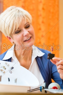 Deaf woman with hearing aid