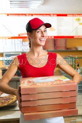 Delivery service - woman holding pizza boxes