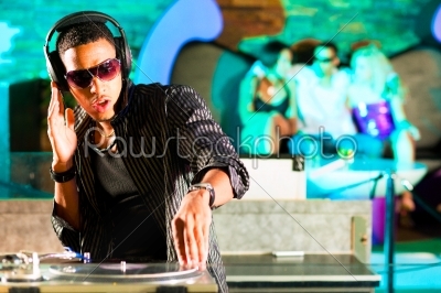 DJ in disco club, crowd background