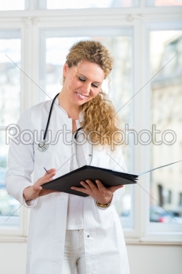 doctor with test result in document or dossier