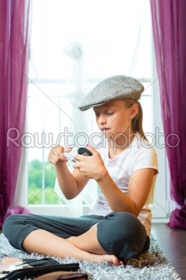 Family - child sitting with cap in room