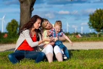 Family - Grandmother, mother and child in garden