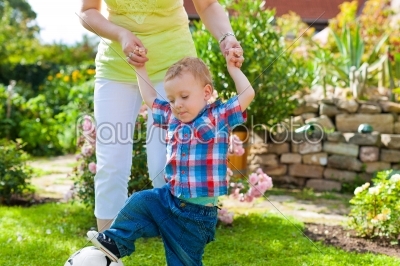 Family - mother and child in garden