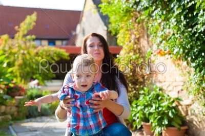Family - mother and child in garden