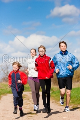 Family is running outdoors