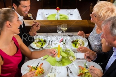 Family with adult kids in Restaurant
