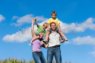 Family with children on a meadow
