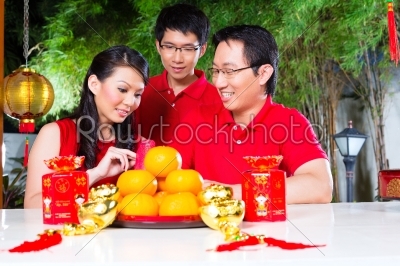 Family with Chinese new year traditional gift