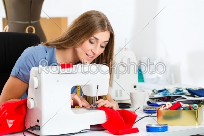 Fashion designer or tailor working in studio