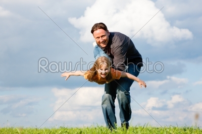 Father and child playing together