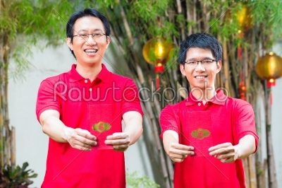 Father and son with Chinese new year gift