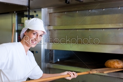 Female baker baking bread