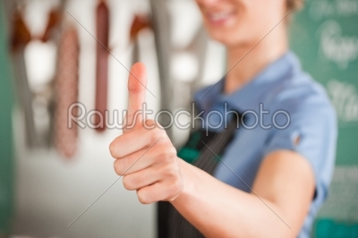 Female Butcher Showing Thumbs Up Sign