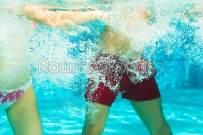Fitness - sports and gymnastics under water in swimming pool or spa