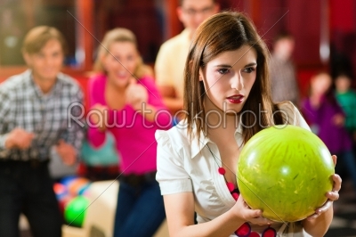 Friends bowling having fun