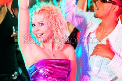 Friends dancing in club or disco