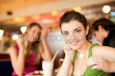 Friends in Restaurant eating fast food