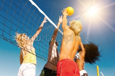 Friends playing Beach volleyball