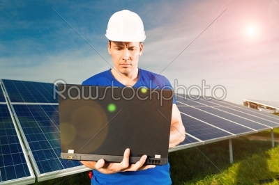 Green Energy - Solar panels with blue sky