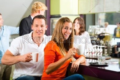 Group of people in Cafe drinking coffee