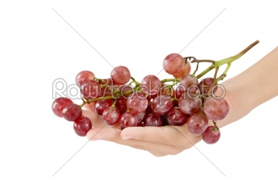 hand and grapes