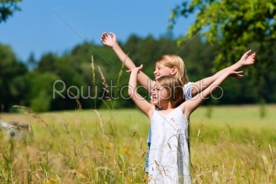 Happy children in a meadow