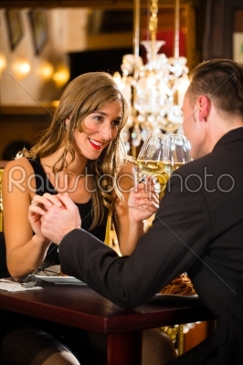 happy couple have a romantic date in restaurant