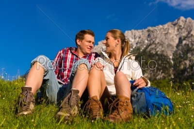 Happy Couple hiking in alp mountains
