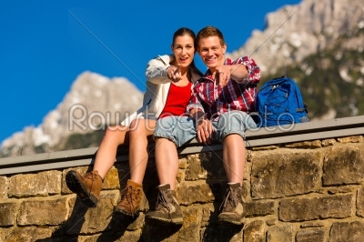 Happy Couple hiking in alp mountains