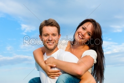 Happy couple on a meadow