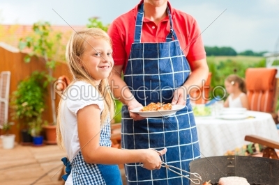Happy family having a barbecue