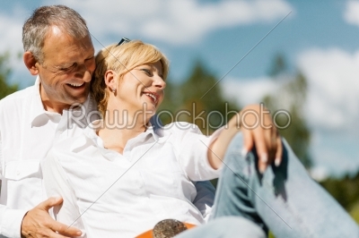 Happy senior couple outdoors in spring