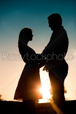 Love - sunset couple embracing each other