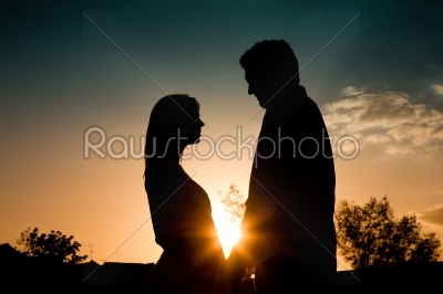 Love - sunset couple embracing each other