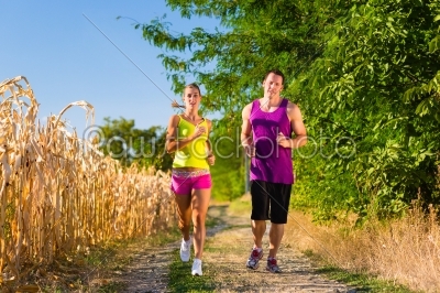 Man and woman running for sport 