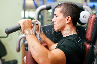 Man in gym exercising