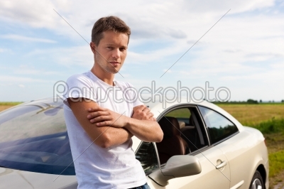 Man leaning on his car