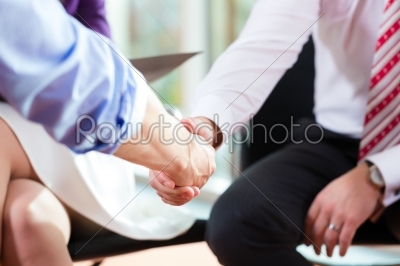 Man shaking hands with manager at job interview closeup cutout