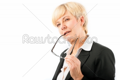 Mature woman playing with her glasses