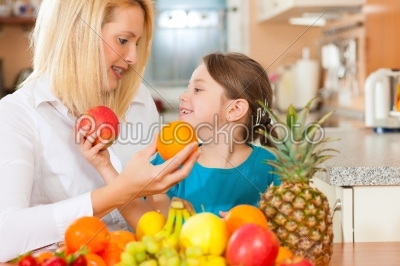 Mother and child with lots of fruits