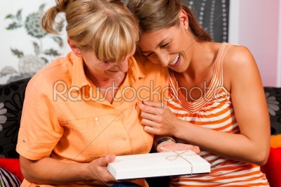 Mother and daughter with gift