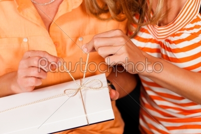 Mother and daughter with gift